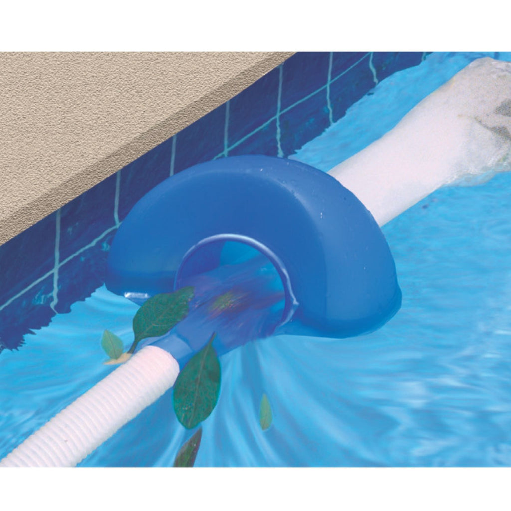Blue pool surface skimmer attached to tiled pool wall edge with white hose, collecting floating leaves from water surface