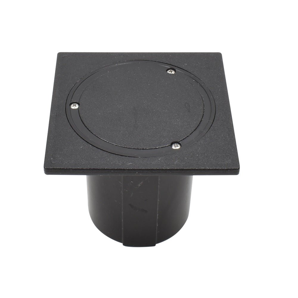 Black square in-ground electrical deck box with circular recessed lid, three screw fixings, and cylindrical housing body