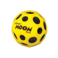 Yellow Waboba Moon Ball with black crater-style dimples, foam bounce ball on white background