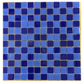 Glass mosaic tile sheet with mixed cobalt and light blue glossy square tiles in random pattern on mesh backing