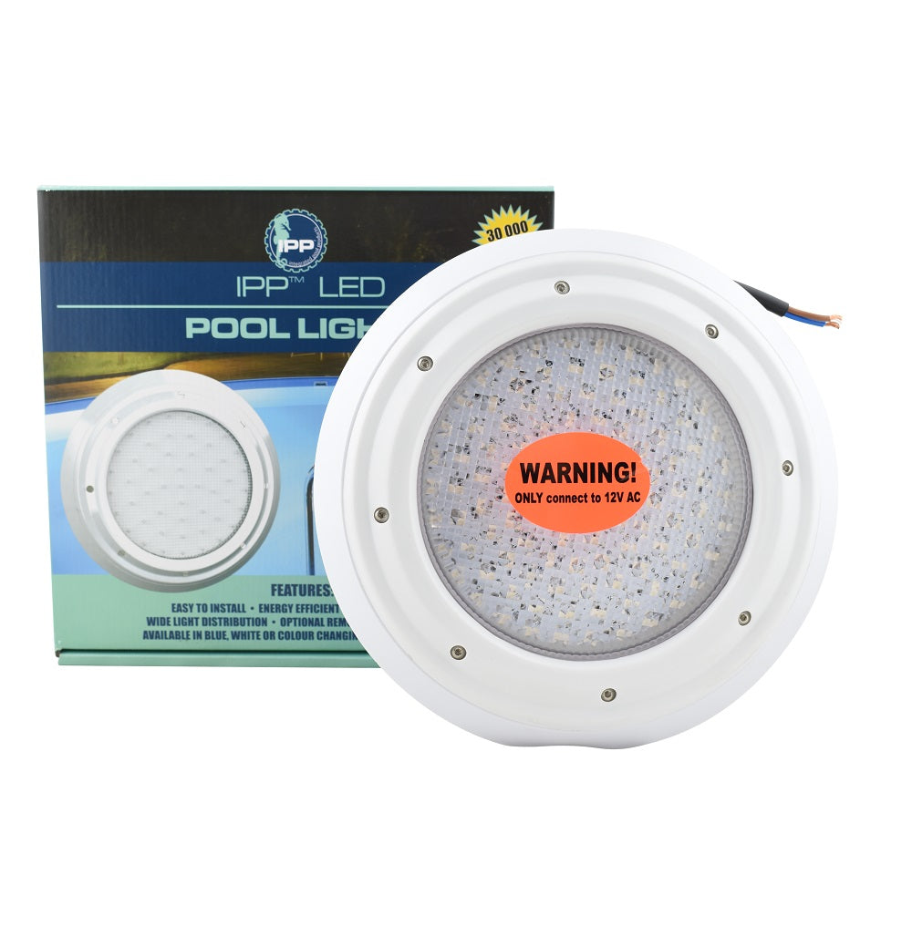 Round white IPP LED pool light with orange 12V AC warning label, shown with retail box