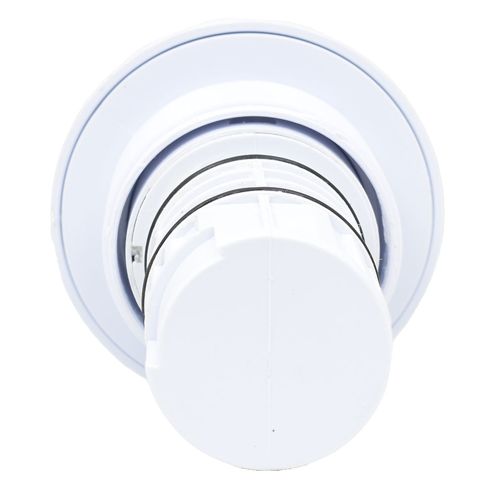 White plastic spa jet inner with concentric circular rings and central rounded cap, rubber seals visible