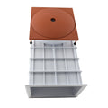 Terracotta square weir top with central hole and open white plastic grid-divided sump drawer pulled out beneath