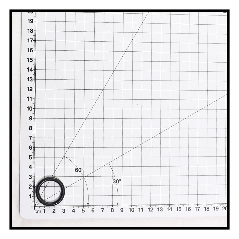 Black rubber O-ring for multiport valve sight glass shown on white metric grid measuring mat, approximately 2cm diameter