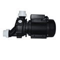 Black spa pump with ribbed motor housing, two white threaded inlet/outlet ports and wet-tested label, self-draining 0.6kW design
