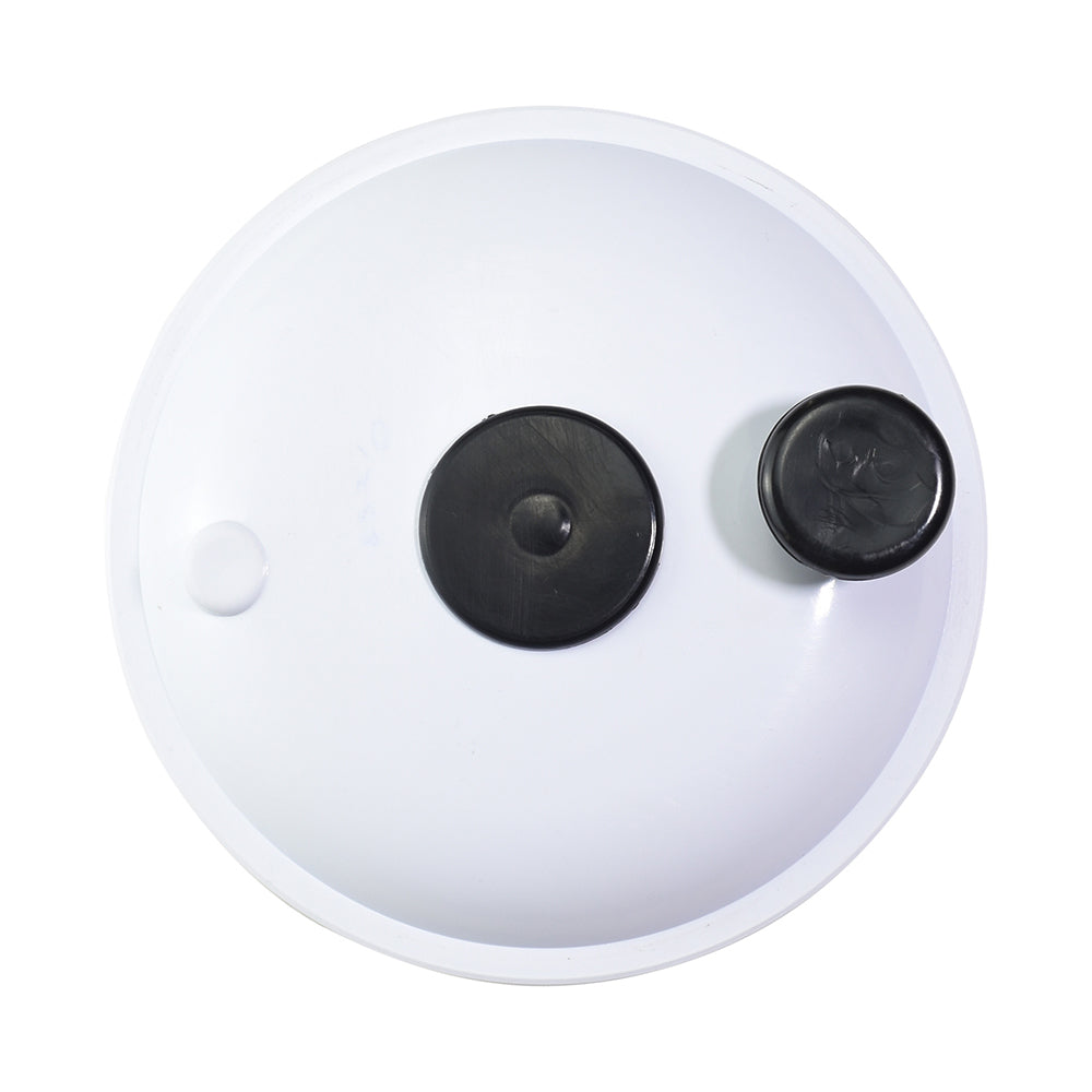 White round spa cartridge filter lid with two black rubber port plugs, viewed from above