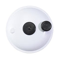 White round spa cartridge filter lid with two black rubber port plugs, viewed from above