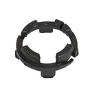 Black plastic compression ring with segmented outer edge, directional "This Side Up" embossed text, and notched locking tabs