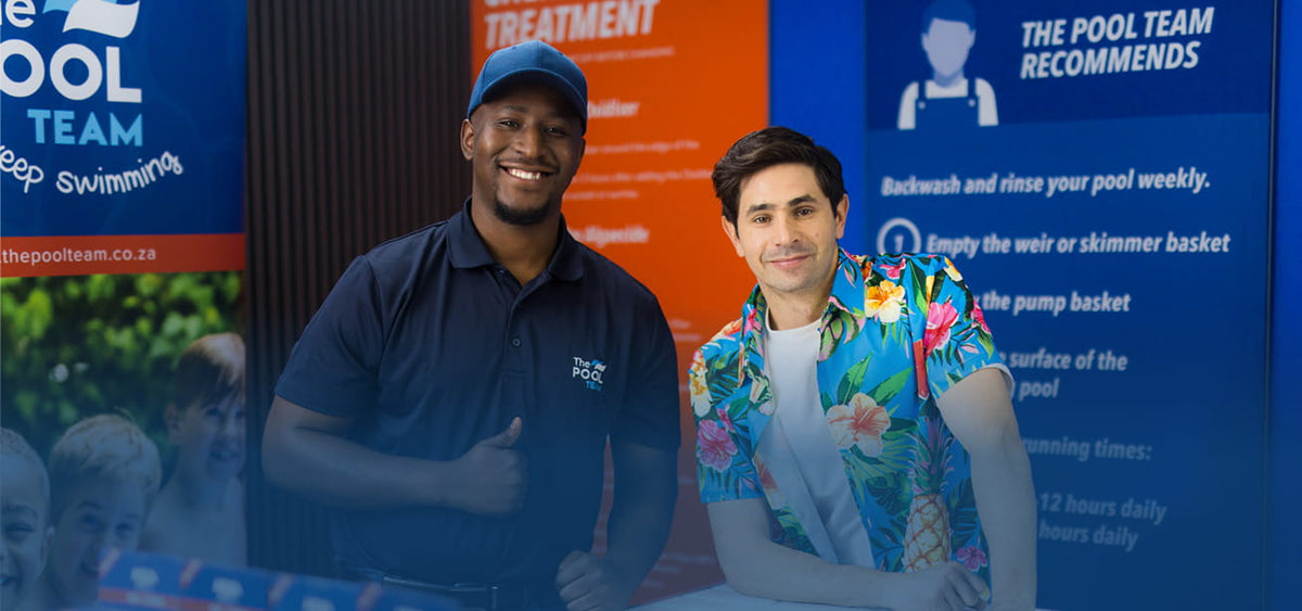 The Pool Team staff member in branded polo and cap alongside a smiling customer in a tropical shirt, posed in front of pool care signage